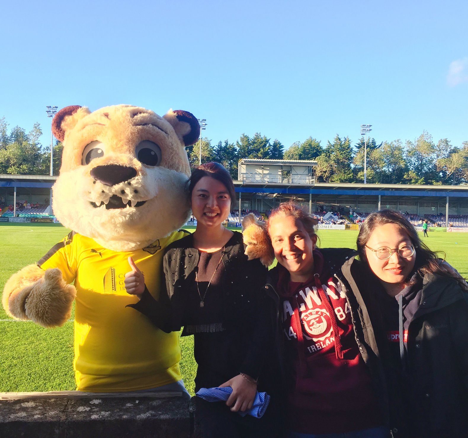Alessandra and friends from GCI with the team mascot at a Galway United game